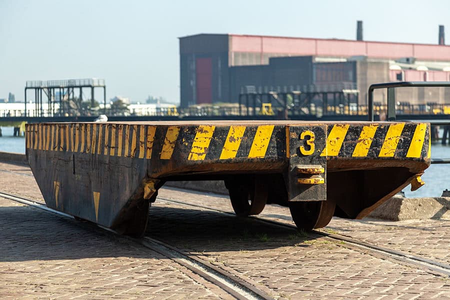 r-transfer-cars Old rusty car trailer at Harbor of Rotterdam during daytime